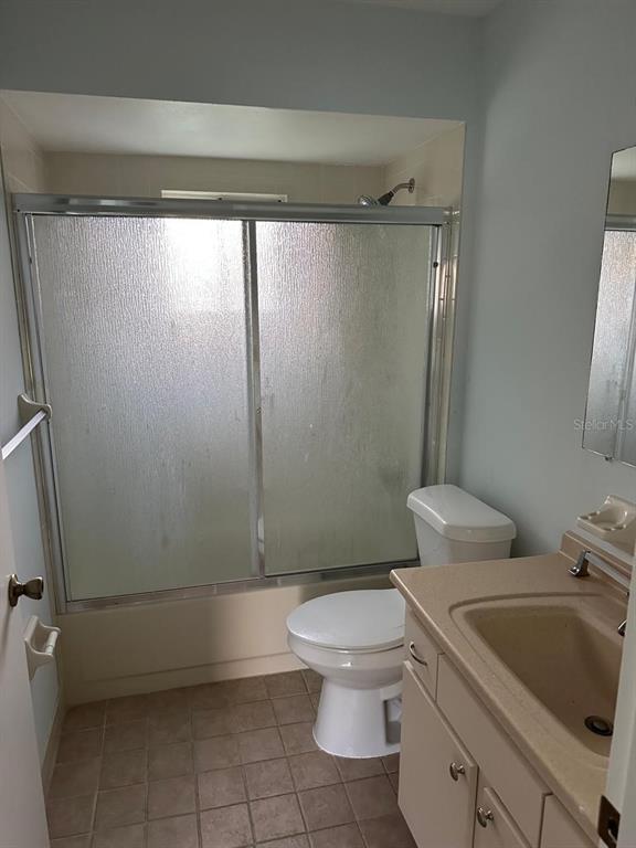 11248 Southwest 76th Terrace Ocala, FL 34476 - Photo 12 of 17 a white toilet sitting next to a bathroom sink and tub