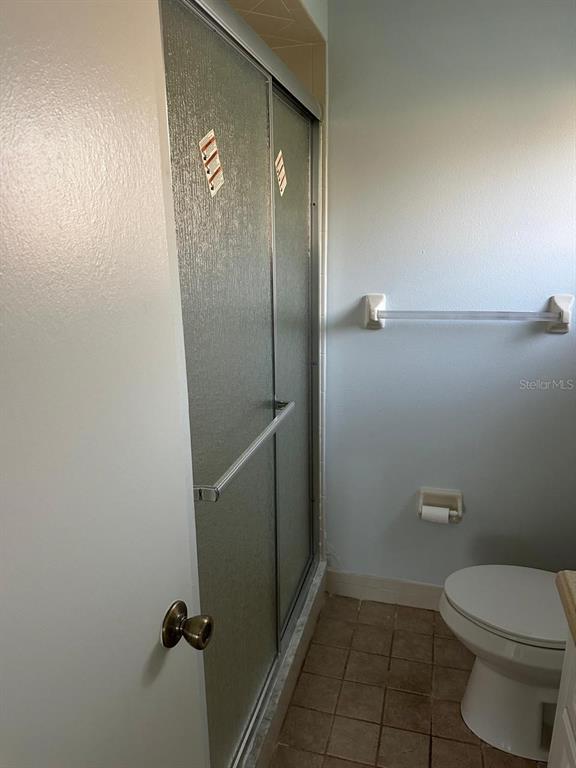 11248 Southwest 76th Terrace Ocala, FL 34476 - Photo 14 of 17 a bathroom with a toilet and a shower