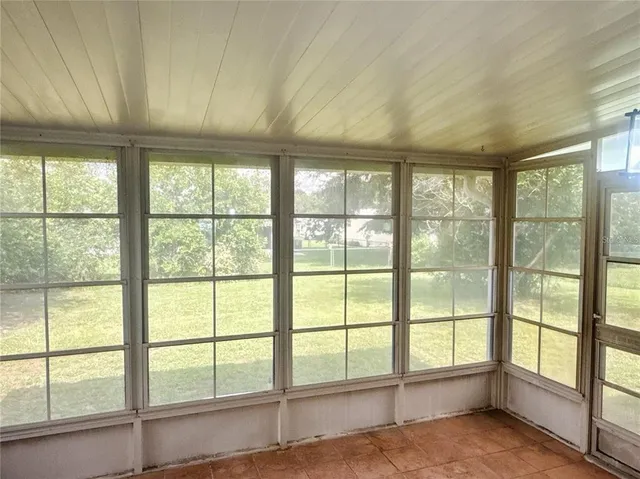 a view of an empty room with a large window
