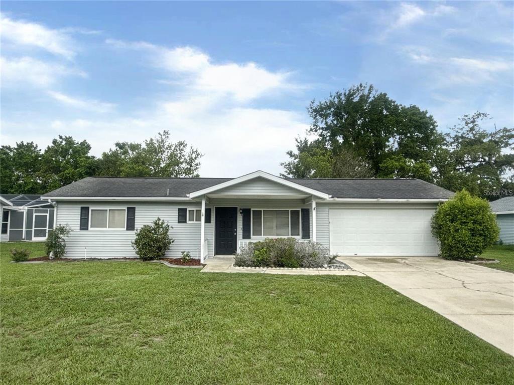11248 Southwest 76th Terrace Ocala, FL 34476 - Photo 4 of 17 a front view of house with yard and green space