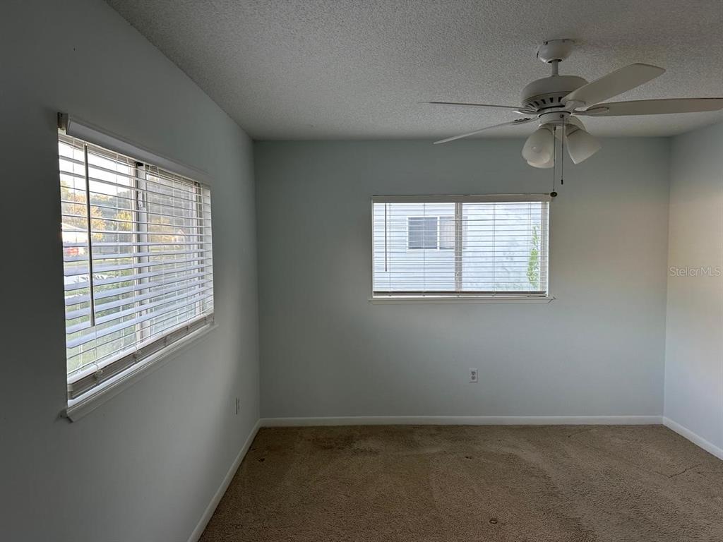 11248 Southwest 76th Terrace Ocala, FL 34476 - Photo 8 of 17 an empty room with a window