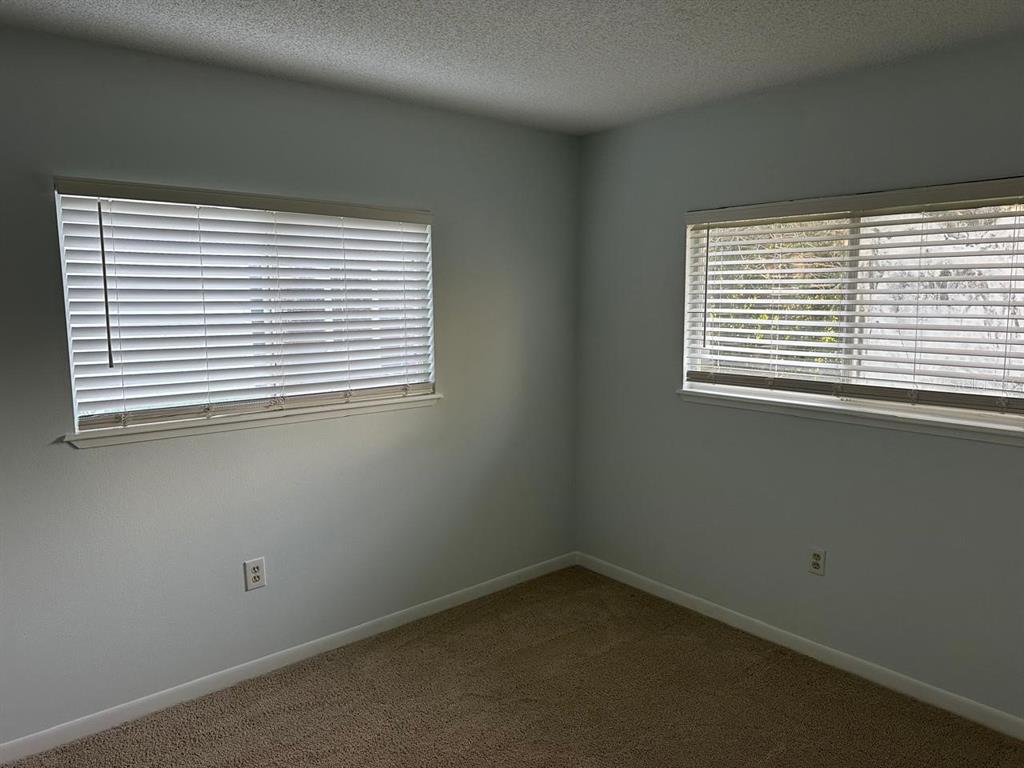 11248 Southwest 76th Terrace Ocala, FL 34476 - Photo 9 of 17 an empty room with a window