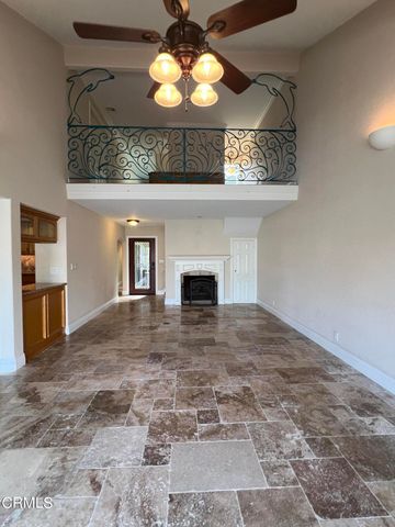 a view of a kitchen with a microwave and cabinets