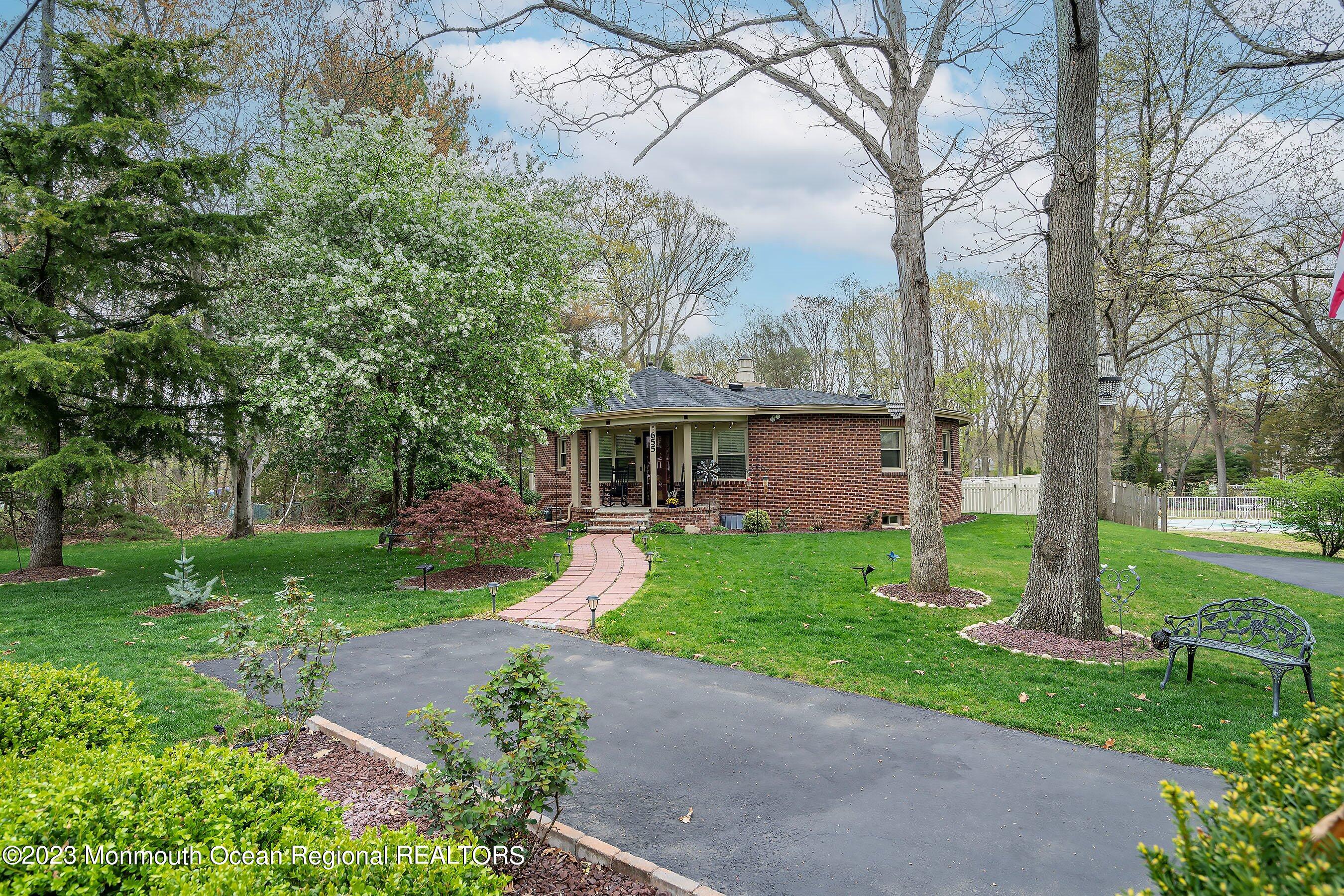 655 Burke Road Jackson, NJ 08527 - Photo 1 of 23 a front view of a house with garden