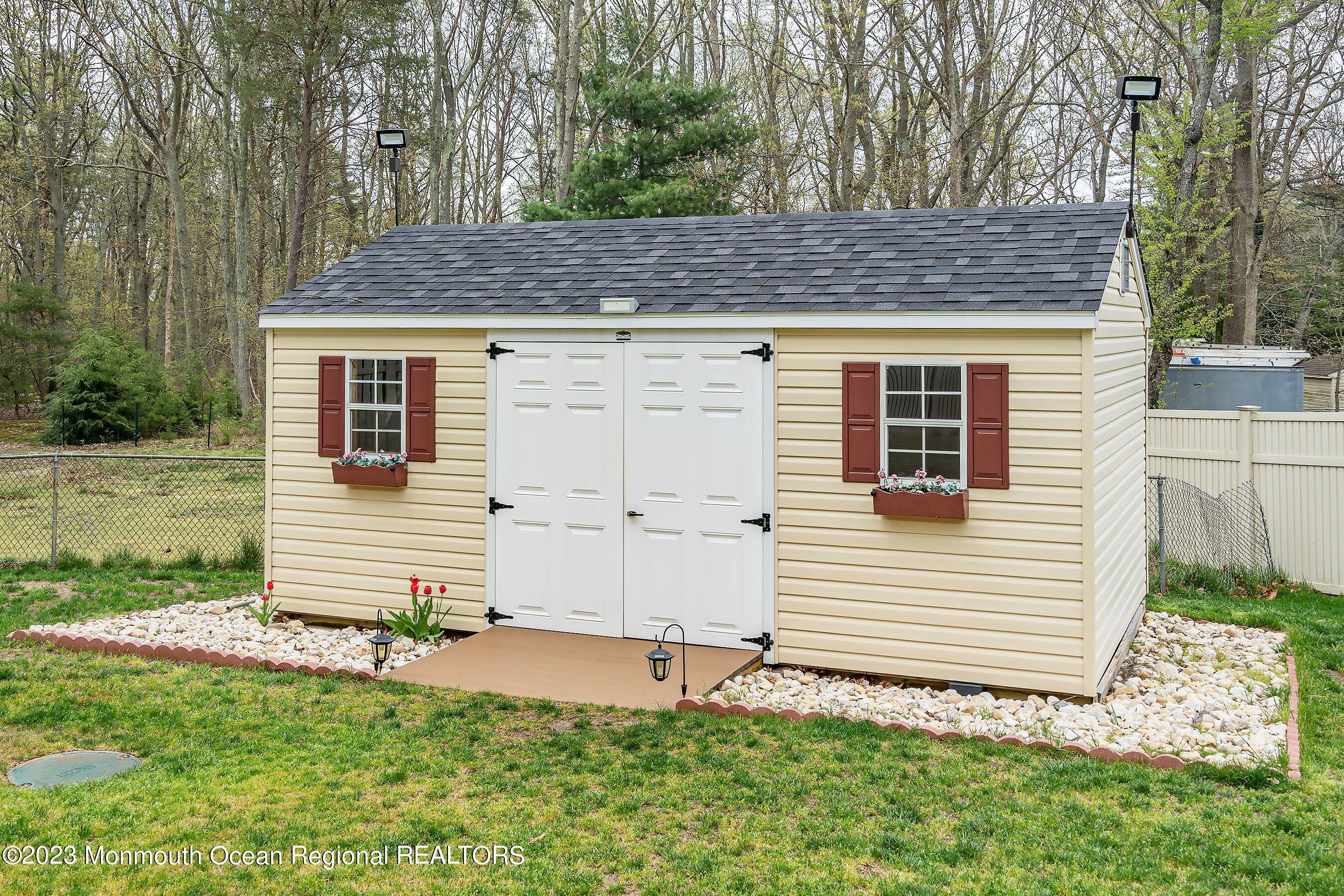 655 Burke Road Jackson, NJ 08527 - Photo 22 of 23 a front view of a house with a yard