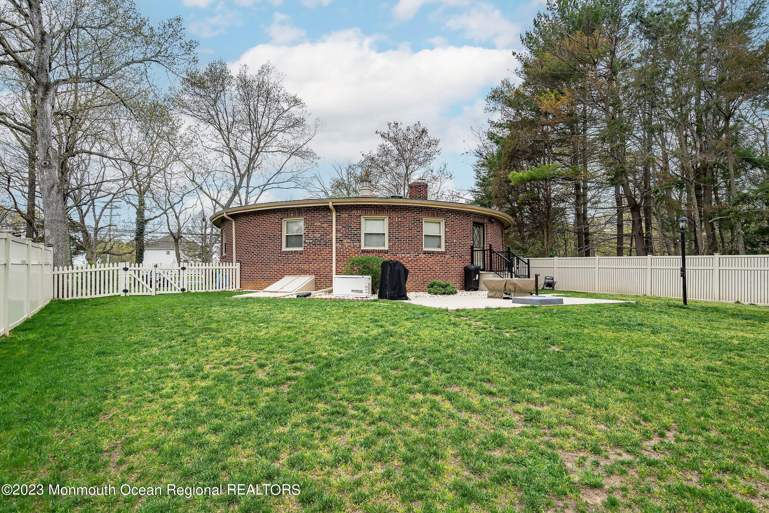 655 Burke Road Jackson, NJ 08527 - Photo 23 of 23 a front view of house with yard and green space