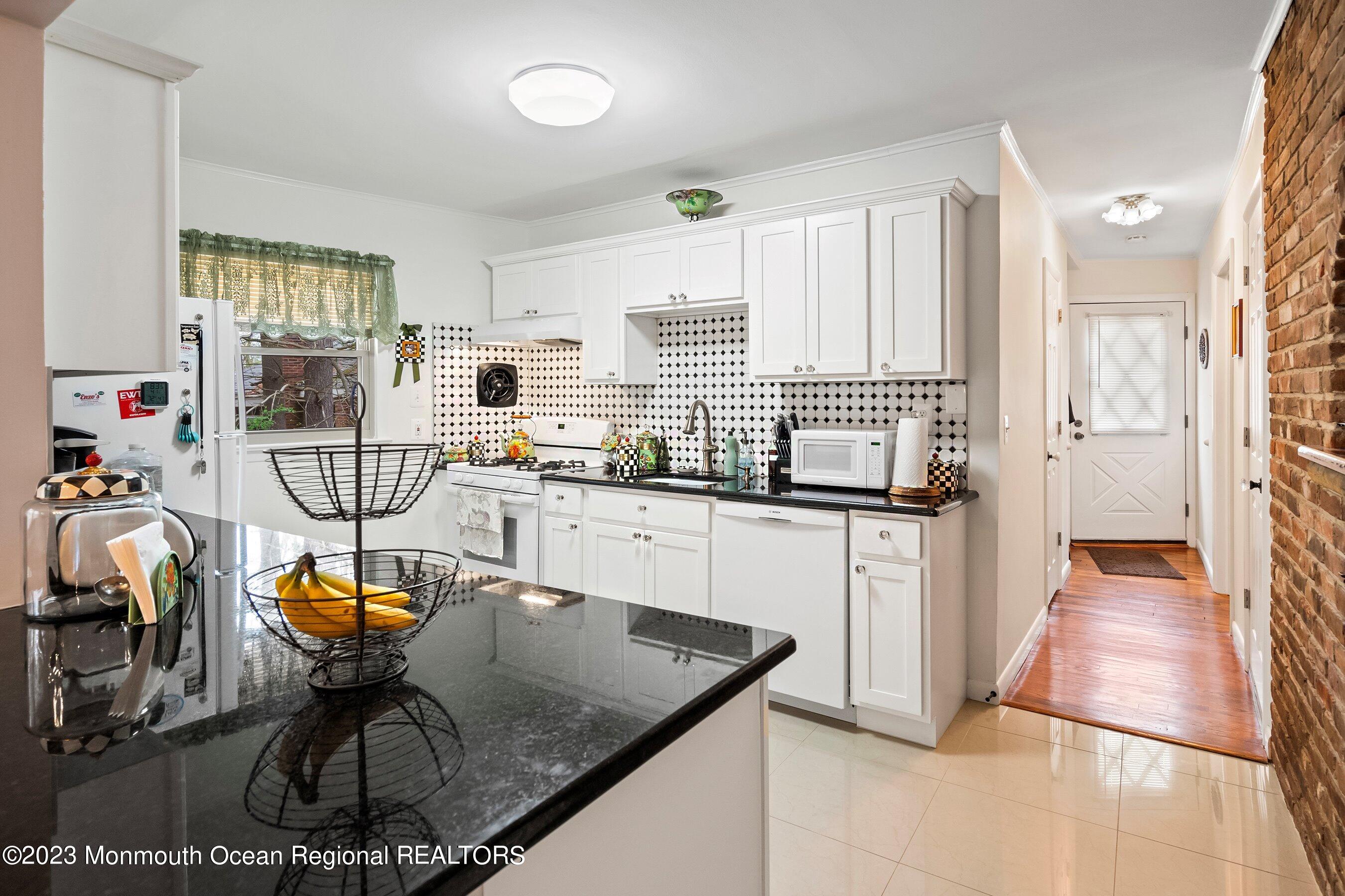 655 Burke Road Jackson, NJ 08527 - Photo 6 of 23 a kitchen with sink cabinets and outdoor seating