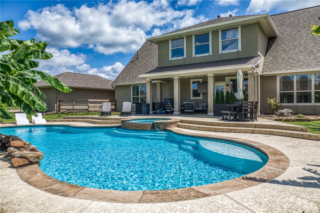 586 Ruby Drive Bellville, TX 77418 - Photo 3 of 50 a view of a house with swimming pool and sitting area