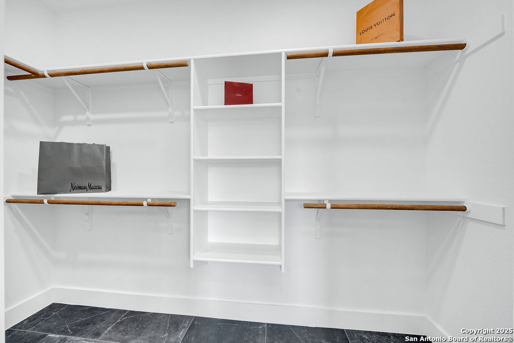 661 Jonquil Drive Spring Branch, TX 78070 - Photo 11 of 18 a view of a walk in closet