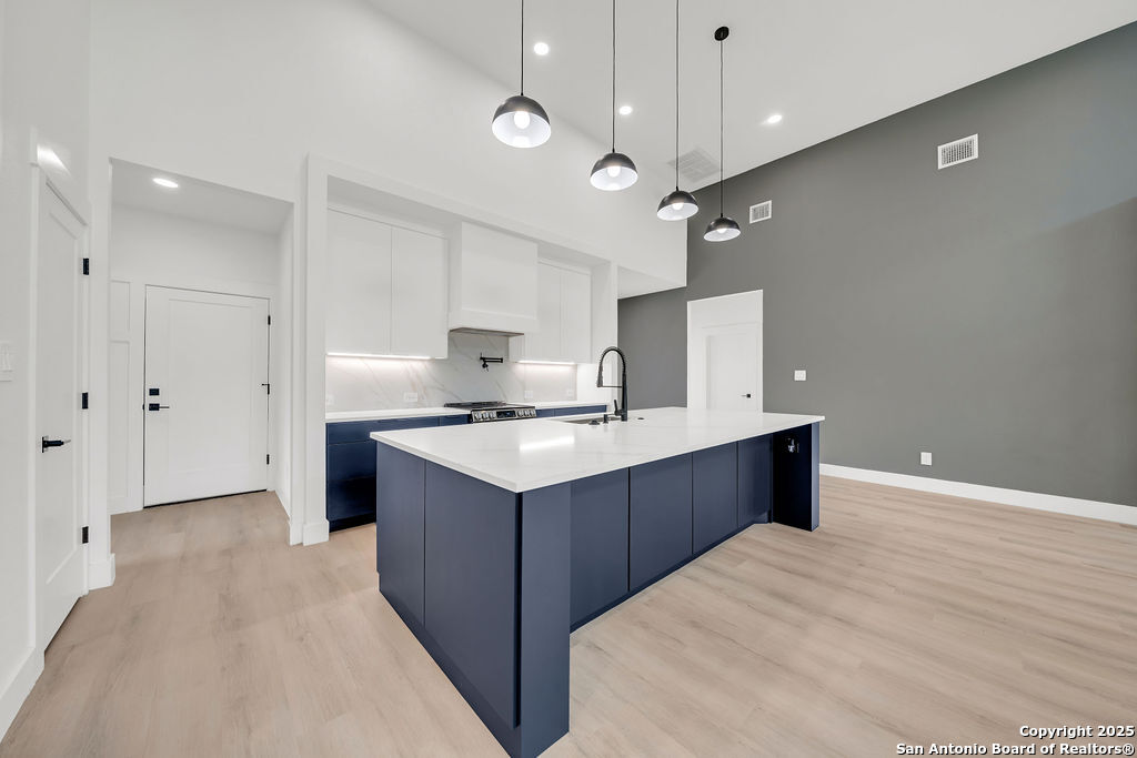 661 Jonquil Drive Spring Branch, TX 78070 - Photo 4 of 18 a kitchen with a stove kitchen island and stainless steel appliances