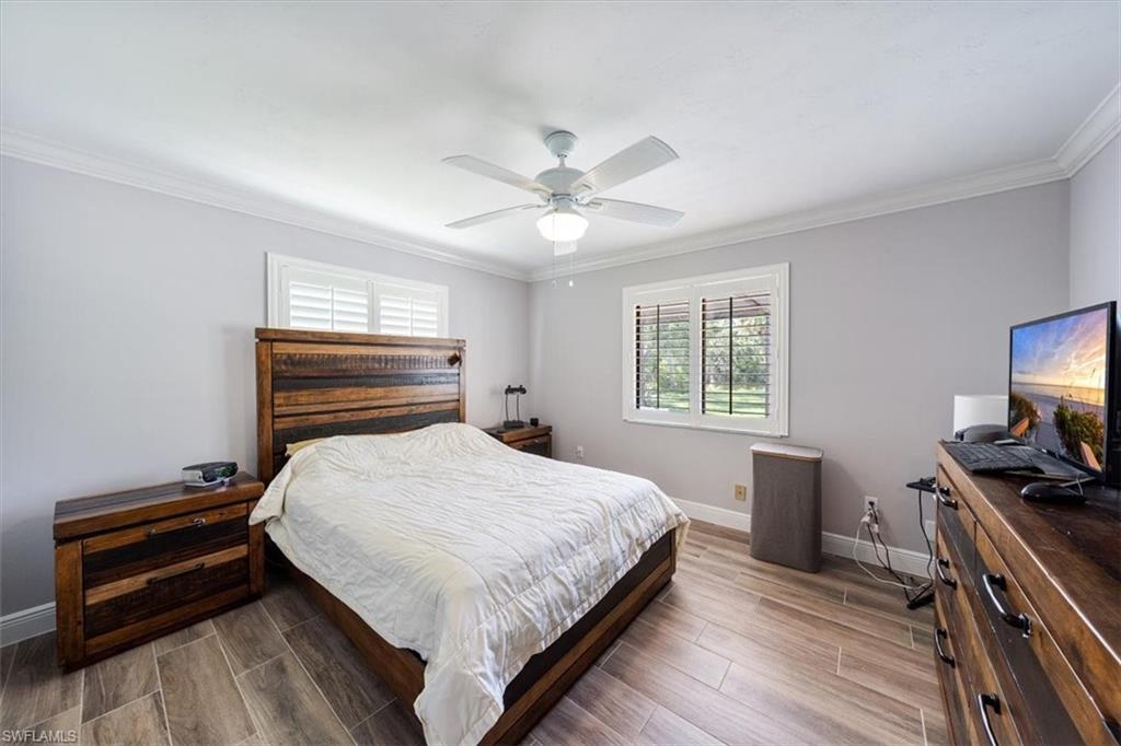 4231-4241 Orange River Loop Road Fort Myers, FL 33905 - Photo 11 of 50 a bedroom with a bed and a flat screen tv