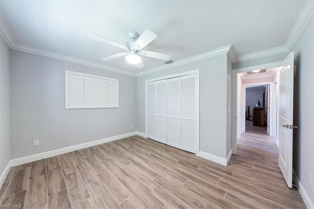 4231-4241 Orange River Loop Road Fort Myers, FL 33905 - Photo 13 of 50 wooden floor in an empty room with a window