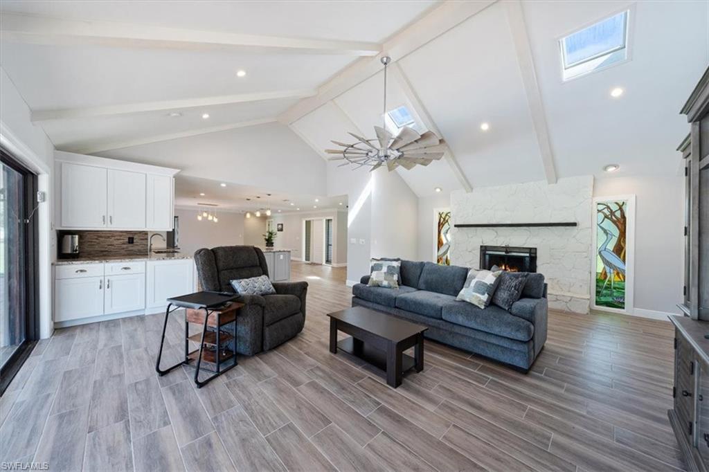 4231-4241 Orange River Loop Road Fort Myers, FL 33905 - Photo 15 of 50 a living room with furniture and a wooden floor