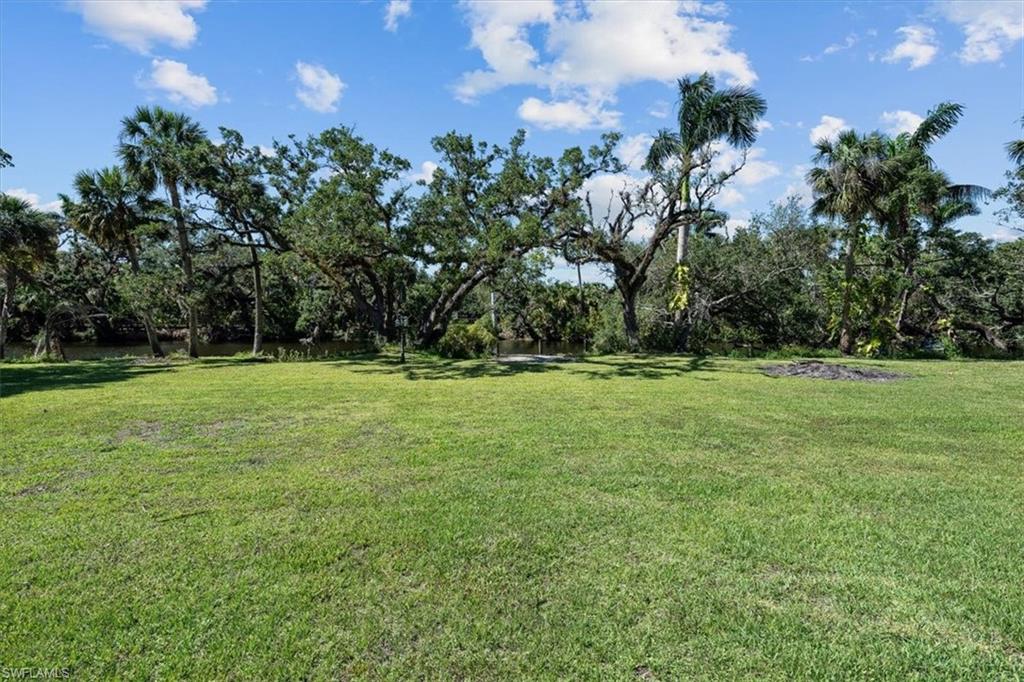 4231-4241 Orange River Loop Road Fort Myers, FL 33905 - Photo 23 of 50 a view of a field with a tree in the background