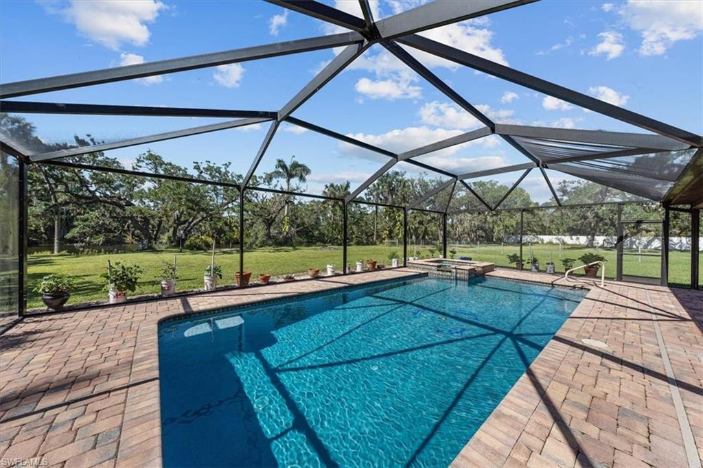 4231-4241 Orange River Loop Road Fort Myers, FL 33905 - Photo 24 of 50 a view of a backyard with sitting area