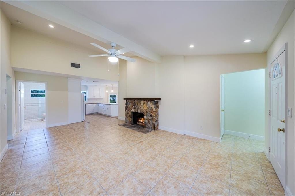 4231-4241 Orange River Loop Road Fort Myers, FL 33905 - Photo 29 of 50 a view of a livingroom with furniture and a ceiling fan