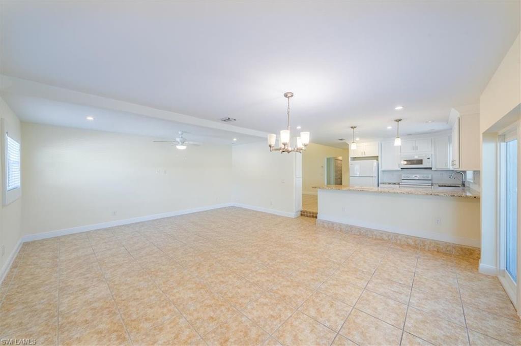 4231-4241 Orange River Loop Road Fort Myers, FL 33905 - Photo 39 of 50 a view of a kitchen with a sink and a microwave