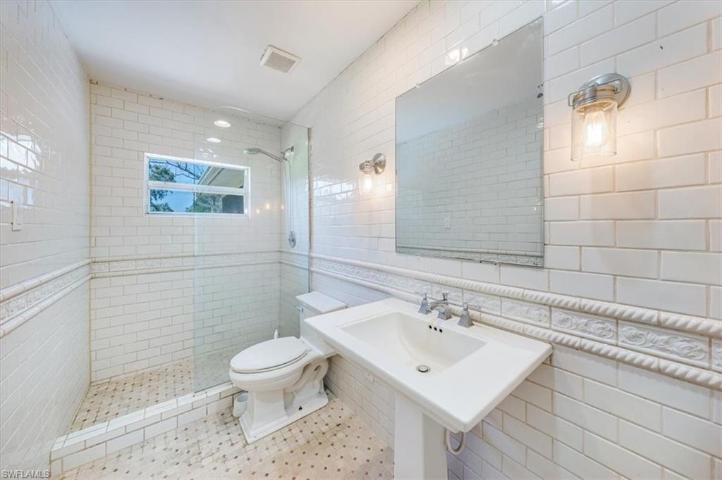 4231-4241 Orange River Loop Road Fort Myers, FL 33905 - Photo 43 of 50 a bathroom with a sink a toilet and shower