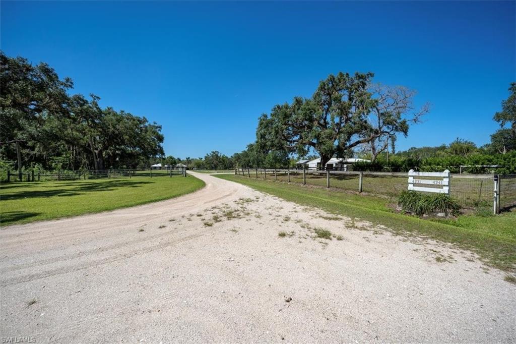 4231-4241 Orange River Loop Road Fort Myers, FL 33905 - Photo 46 of 50 a view of a lake with a big yard