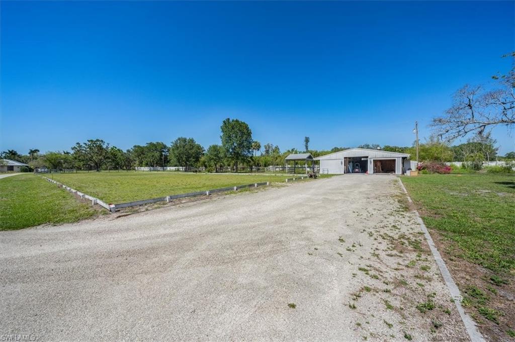 4231-4241 Orange River Loop Road Fort Myers, FL 33905 - Photo 47 of 50 a view of a house with a yard