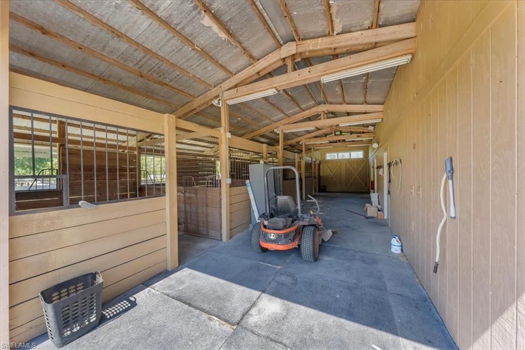 4231-4241 Orange River Loop Road Fort Myers, FL 33905 - Photo 48 of 50 a view of a room with wooden floor and chair
