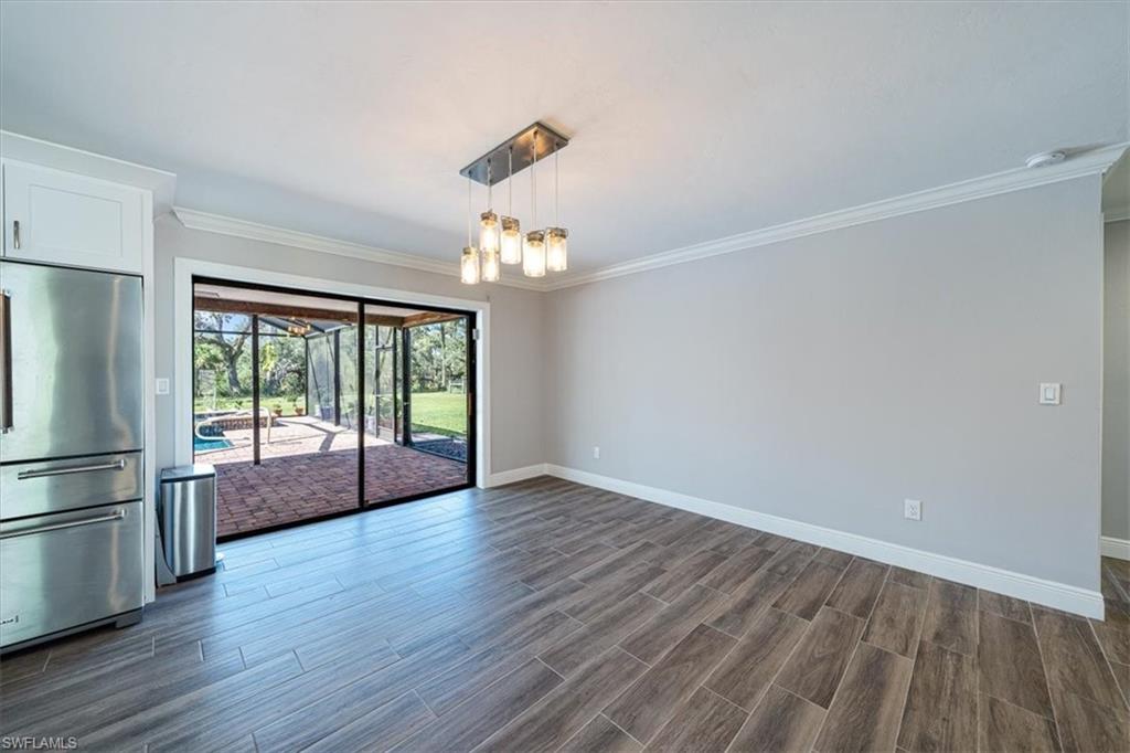 4231-4241 Orange River Loop Road Fort Myers, FL 33905 - Photo 5 of 50 a view of empty room with wooden floor and fan