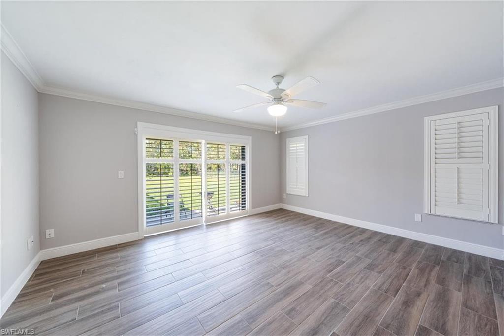 4231-4241 Orange River Loop Road Fort Myers, FL 33905 - Photo 7 of 50 a view of an empty room with wooden floor and a window