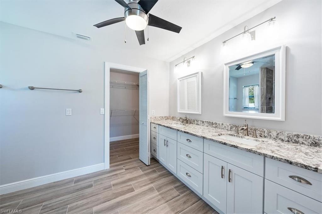 4231-4241 Orange River Loop Road Fort Myers, FL 33905 - Photo 8 of 50 a bathroom with 2 sink and a mirror