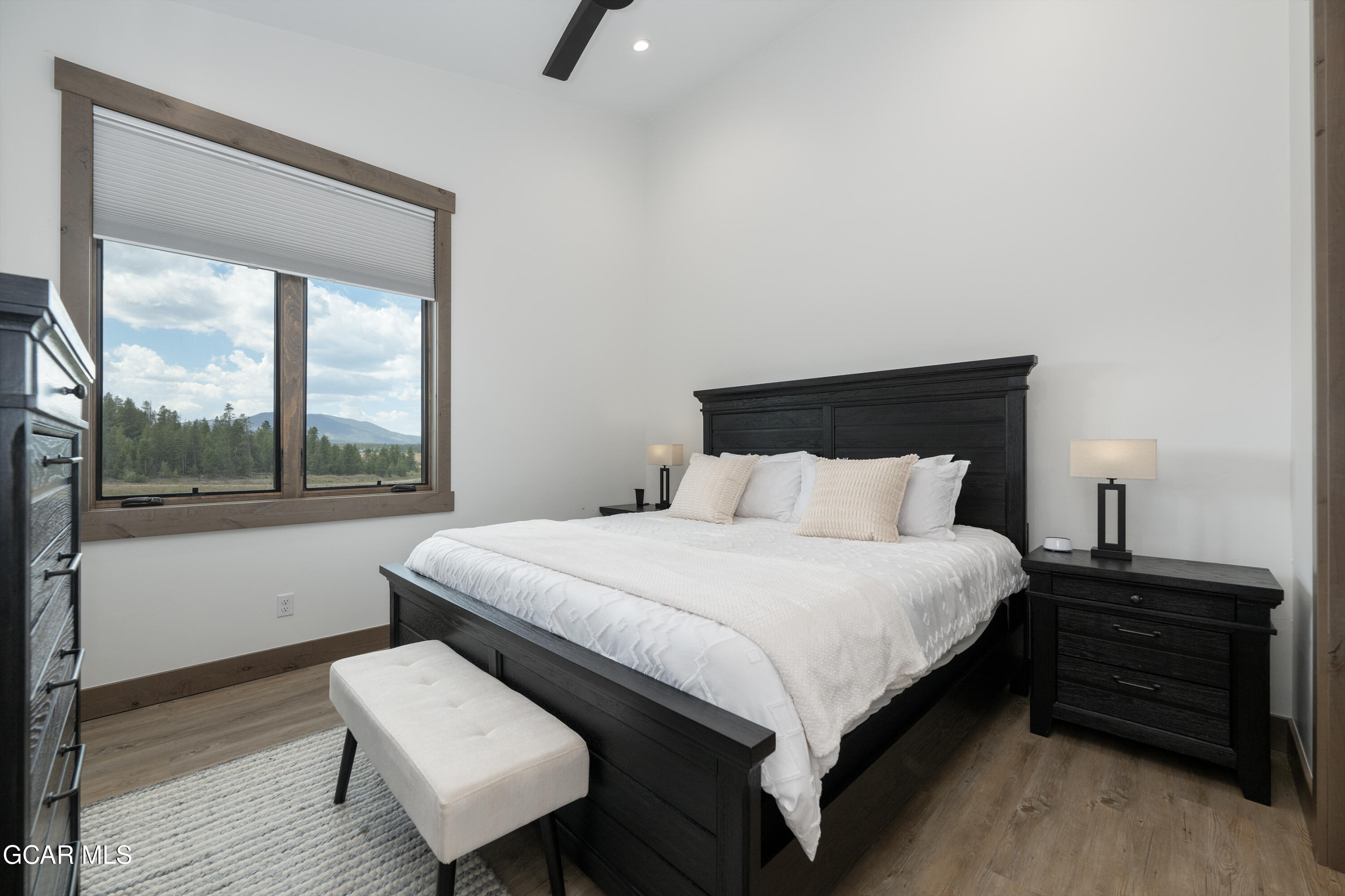 96 Meadow Trail, Unit G304 Fraser, CO 80442 - Photo 16 of 37 a bedroom with a bed and a window
