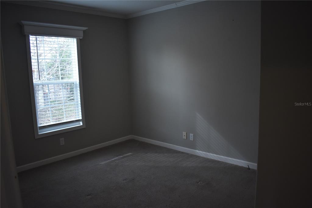 2750 Ranch House Road Orlando, FL 32822 - Photo 2 of 8 an empty room with a window