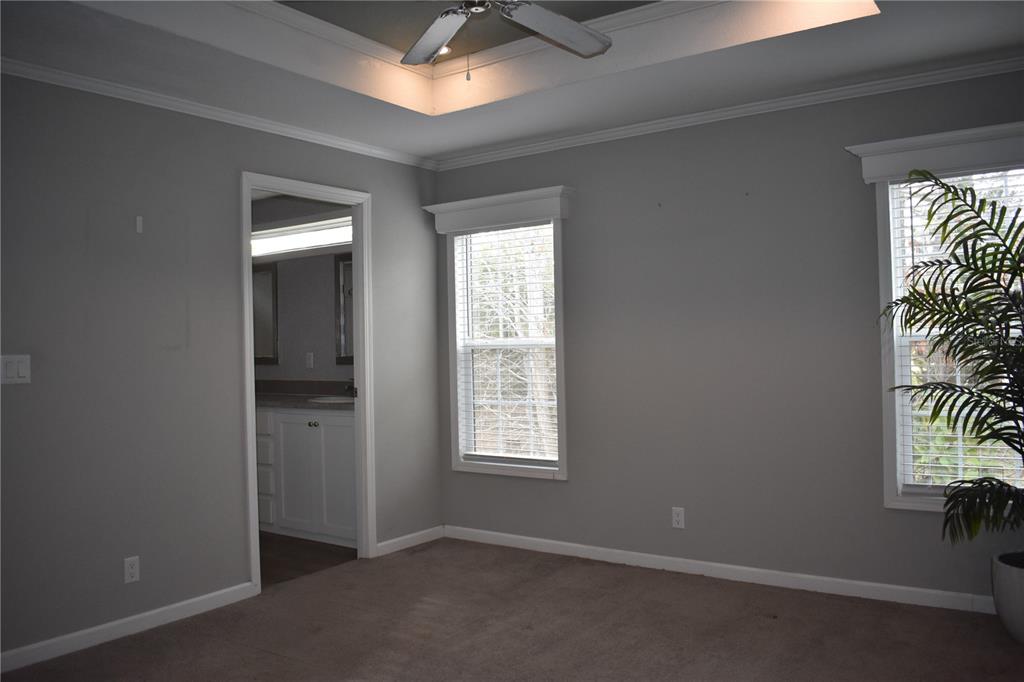 2750 Ranch House Road Orlando, FL 32822 - Photo 4 of 8 an empty room with windows and closet