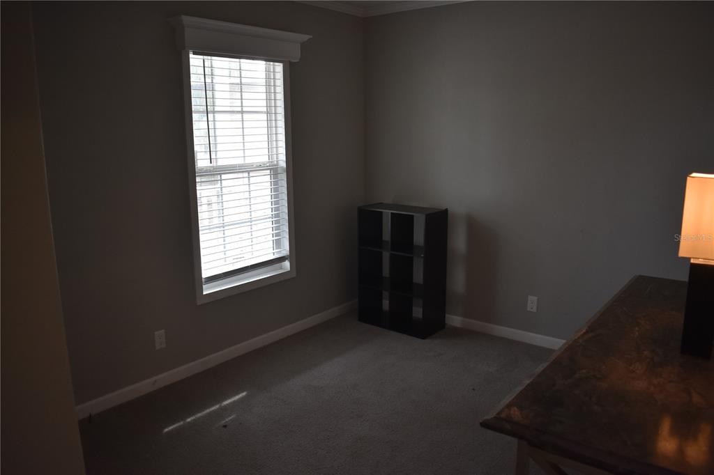 2750 Ranch House Road Orlando, FL 32822 - Photo 5 of 8 an empty room with windows