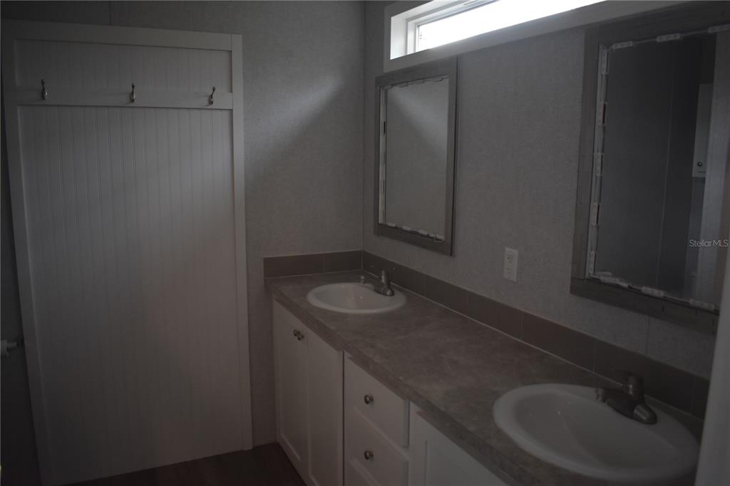 2750 Ranch House Road Orlando, FL 32822 - Photo 6 of 8 a bathroom with a sink and a mirror