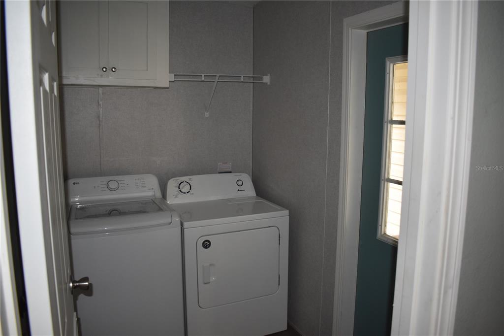 2750 Ranch House Road Orlando, FL 32822 - Photo 8 of 8 a utility room with dryer and washer