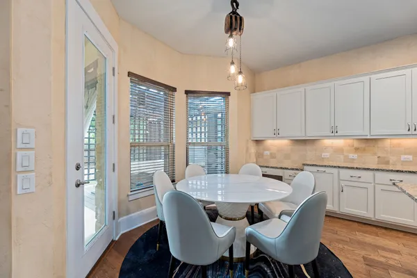 a view of a dining room with furniture window and wooden floor