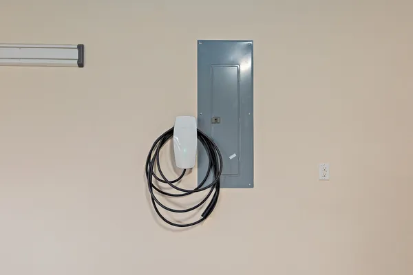 a close view of staircase with a washer and dryer