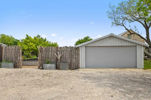 a view of a backyard with sitting area