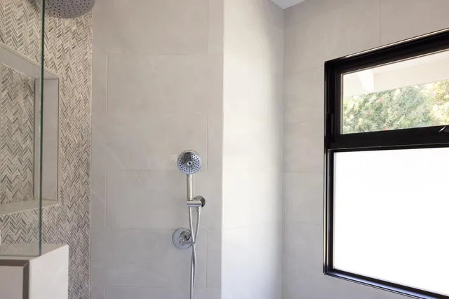 a picture of a room with a door and a window