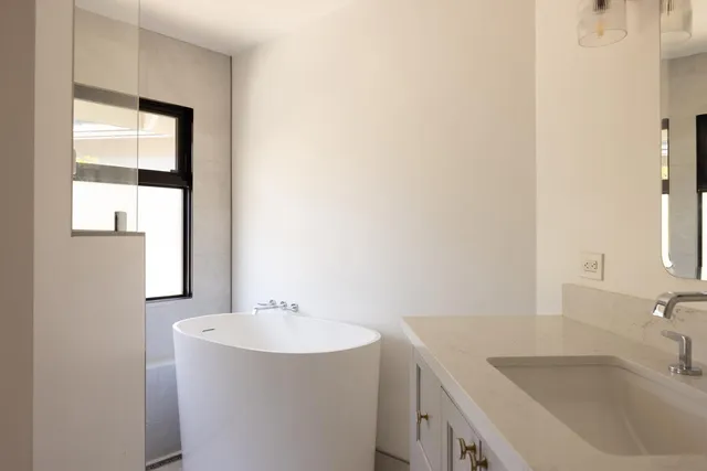 a bathroom with a sink and a large mirror