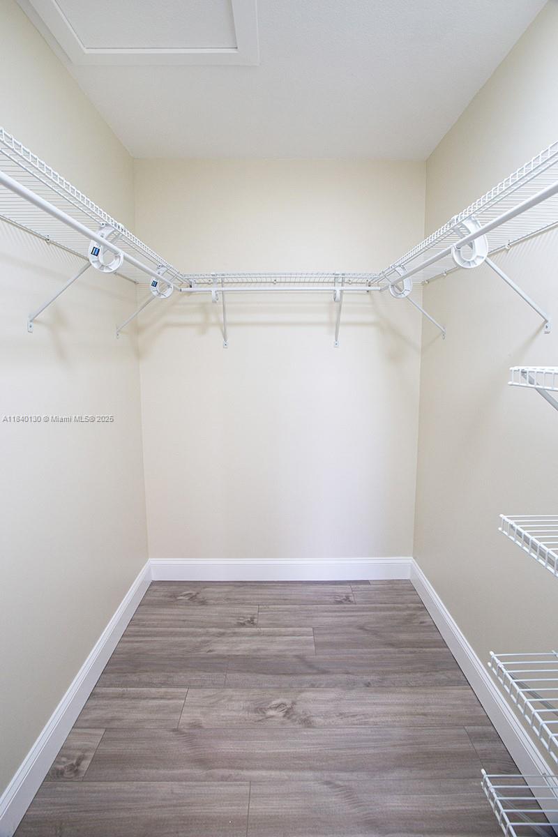 9431 Boca Cove Circle, Unit 1009 Boca Raton, FL 33428 - Photo 25 of 30 a view of a room with empty racks