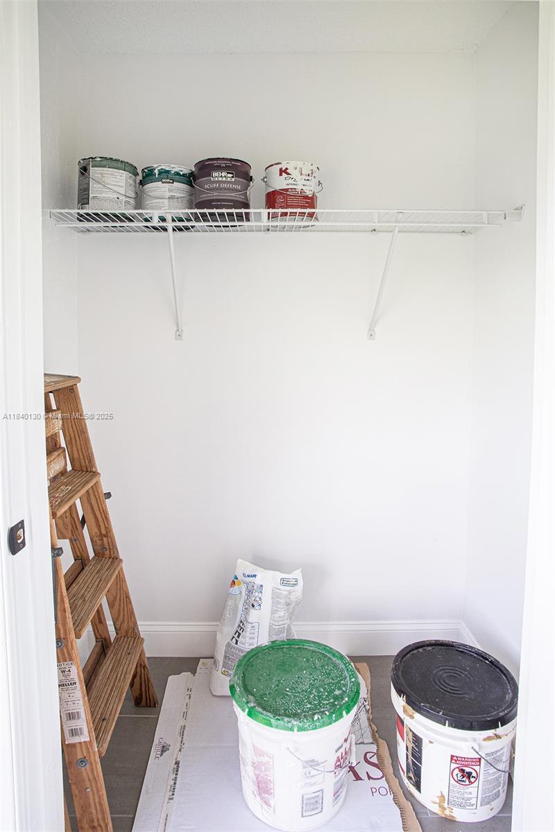 9431 Boca Cove Circle, Unit 1009 Boca Raton, FL 33428 - Photo 26 of 30 a bathroom with a toilet and a sink
