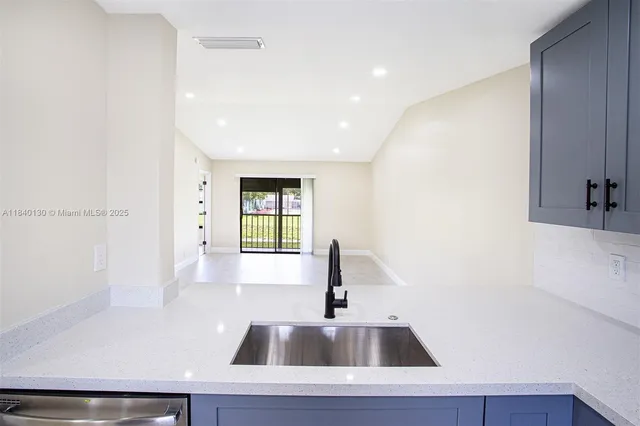 a kitchen with a sink and a window