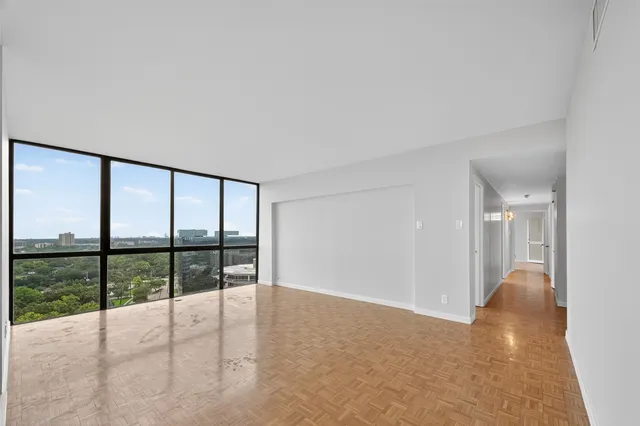 a view of a room with a large window