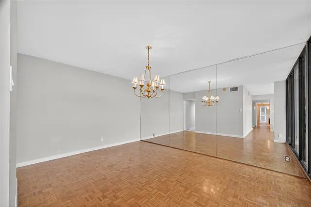 a view of a chandelier in big room and chandelier