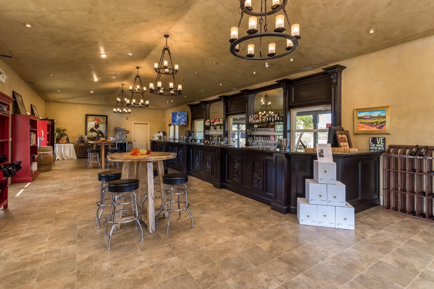 3040 Ponderosa Road Shingle Springs, CA 95682 - Photo 18 of 52 a large kitchen with a table and chairs