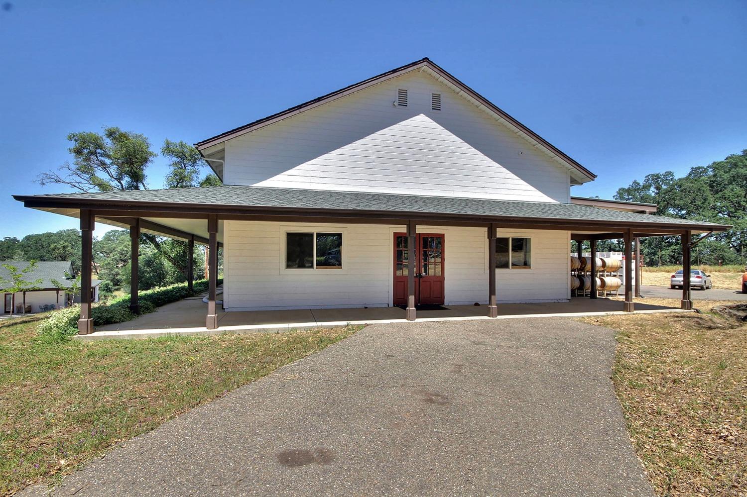 3040 Ponderosa Road Shingle Springs, CA 95682 - Photo 32 of 52 a front view of a house with a yard and porch