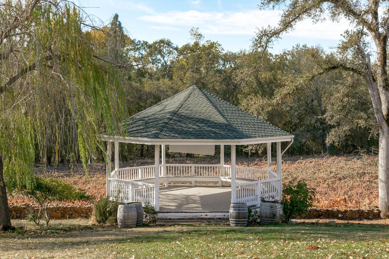3040 Ponderosa Road Shingle Springs, CA 95682 - Photo 35 of 52 a front view of a house with a garden