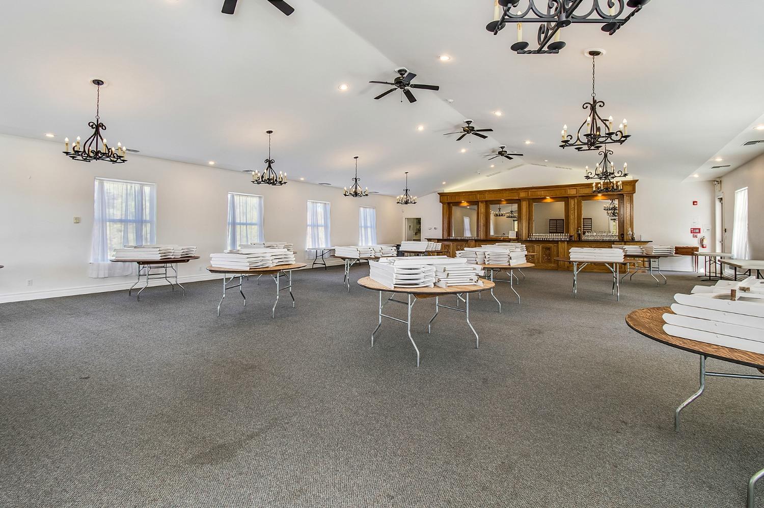 3040 Ponderosa Road Shingle Springs, CA 95682 - Photo 39 of 52 a living room with lots of furniture and a chandelier