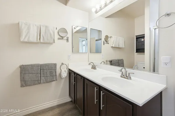 a bathroom with a sink vanity and a mirror