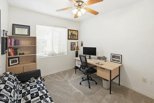 a workspace with furniture and a window